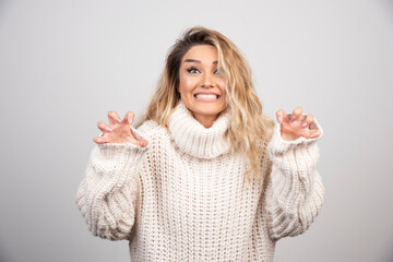 Beautiful woman in winter sweater laughing