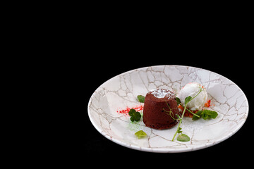 Chocolate fondant with ice cream on a plate
