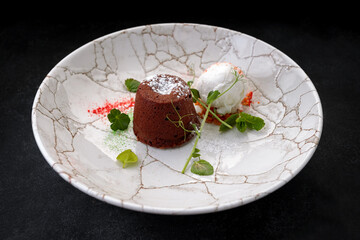 Chocolate fondant with ice cream on a plate