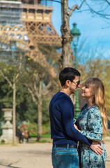 Couple man and woman near the eiffel tower. Selective focus.