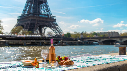 Picnic and wine near the Eiffel Tower. Selective focus.