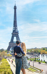 Couple man and woman near the eiffel tower. Selective focus.