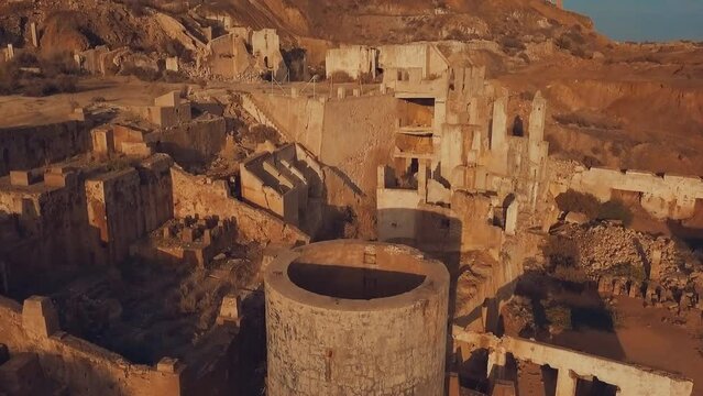 Aerial view of the ruins of an old factory in the Hajar Mountains copper ore deposit, Oman. Al Hajar Mountains.