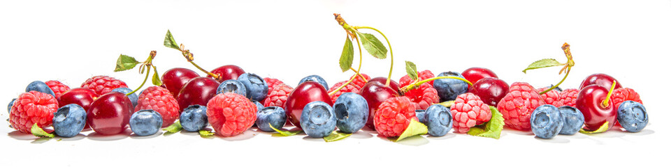 Mix of isolate blueberry, blackberry, raspberry, cherry and mint. Fresh ripe berry set isolated on...
