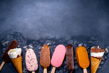 Set of various ice cream popsicle on black background. Assortment of icecream cones and popsicles...