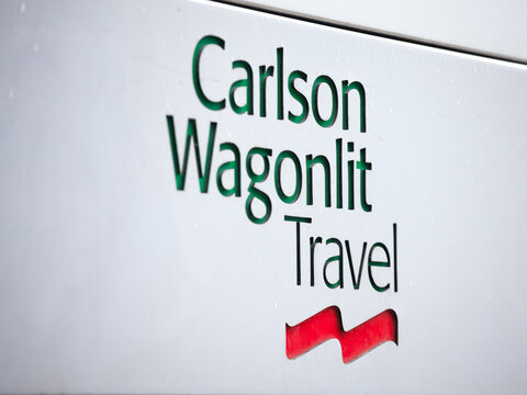 PRAGUE, CZECHIA - NOVEMBER 1, 2019: Carlson Wagonlit Travel logo on their main office for Prague, Carlson Wagonlit Travel, or CWT, is an American travel management company specialized in B2B