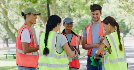 Community service volunteers preparing to clean a local park and pick up trash. Diverse happy group of teenager youth workers doing charity work and taking responsibility for the environment