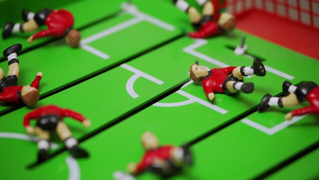 football players lie on the lawn. disastrous final sad finish. failure crisis fail loss. exhausted team failed match. fallen players of two teams. football figurines. massive tragedy.