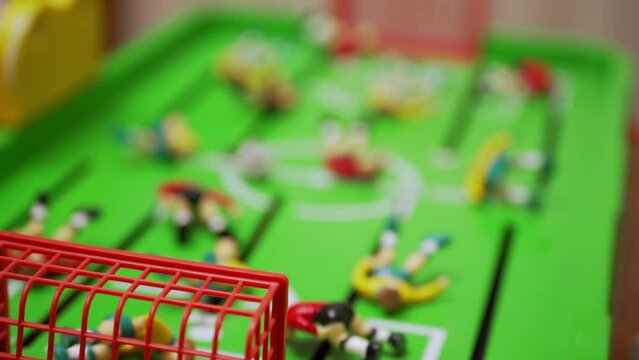 football players lie on the lawn. disastrous final sad finish. failure crisis fail loss. exhausted team failed match. fallen players of two teams. football figurines. massive tragedy.