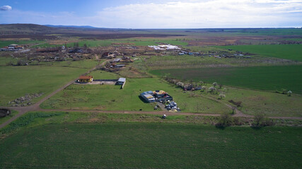 Obraz premium Aerial photography from a drone. View of the fields and the village from a height panoramic view