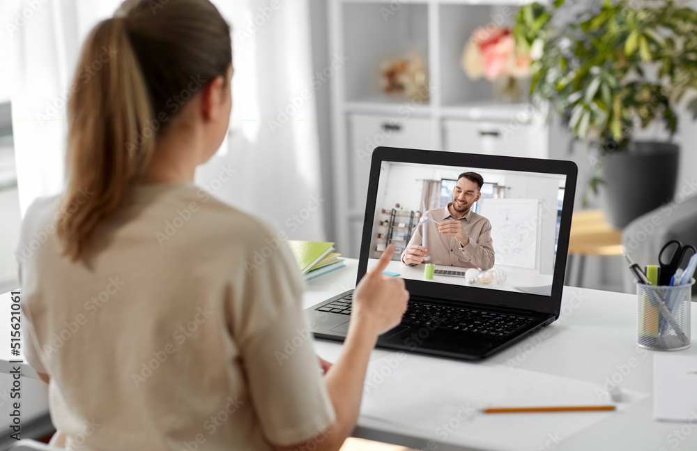 Poster school, education and distance learning concept - female student with teacher on laptop computer screen having video call or online class at home and showing thumbs up