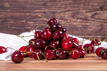 Fresh cherry. Ripe cherries on wood background. Bulk cherries. close up
