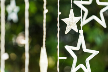 Star shaped lights made of clear white plastic, natural background
