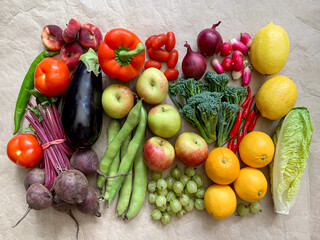Healthy eating grocery shopping or food delivery of fresh fruits and vegetables on craft paper. Rich vitamin healthy lifestyle, vegan, vegetarian diet, nutrition. White 