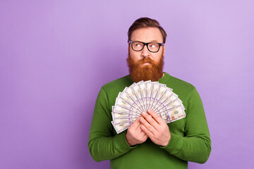 Portrait of young attractive wealthy male brainstorming hold lots of money fan of dollars isolated...