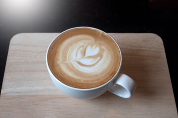 Latte Art Hot coffee in Black color background.