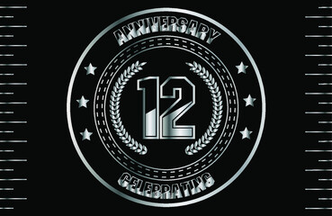 12th silver anniversary logo with ring. Silver anniversary laurel wreath.