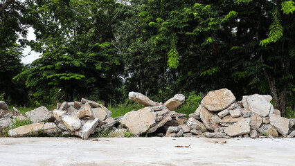 View of the rubble pile of concrete blocks demolished from the road surface and dumped.