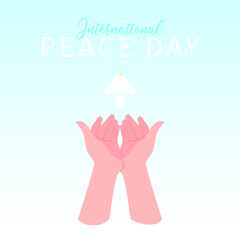 A white dove flies out and a pair of hands of light skin