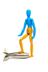 Wooden doll of Ukrainian flag colors, on gray background