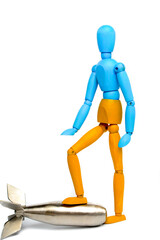 Wooden doll of Ukrainian flag colors, on gray background