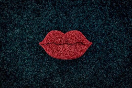 Big red plumpy lips on black background. Beauty concept