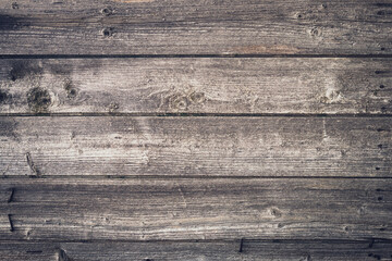 Shabby dark wood texture. Vintage wooden fence, desk surface. Natural color. Weathered timber, background. Gray old wood planks. Blank space. Template. Boards with nails.