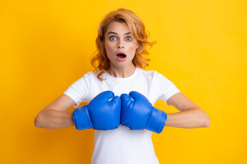 Surprised female boxer. Woman in boxing gloves.