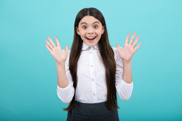 Excited face. Cute young teenager girl against a isolated background. Studio portrait of pretty beautiful child. Amazed expression, cheerful and glad.