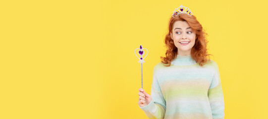 happy redhead woman in queen crown with magic wand, magic. Woman isolated face portrait, banner...