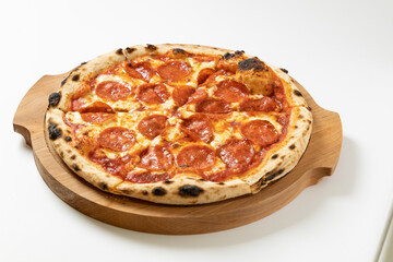 italian pizza with salami on a white background