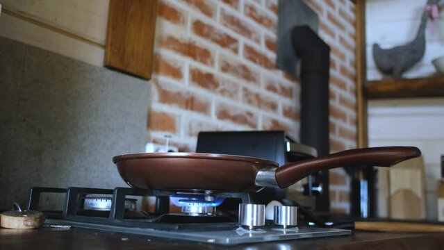 frying pan on a burning gas stove