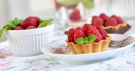 Red berry mini tart cake on a table