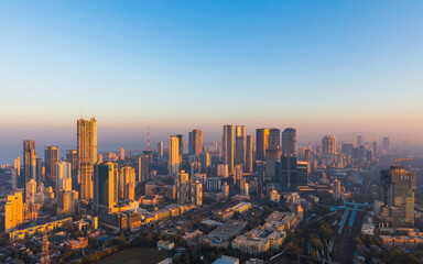 Mumbai skyline lit up in gold by the sunrise.