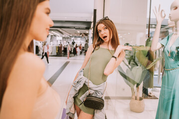 Standing near the shop window