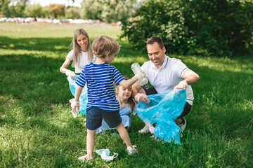 Fototapeta premium Family recycling outdoors together on a summer day at the parc