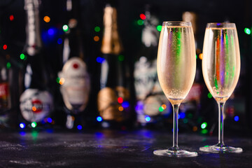 Champagne glasses on a dark background.