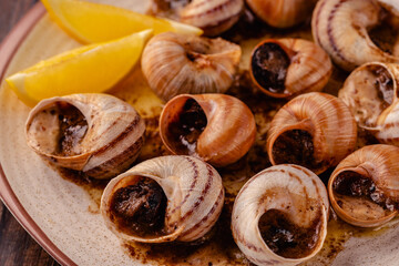 snails with butter on a plate