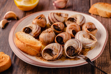 snails with butter on a plate