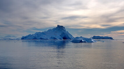 Icebergs floating in front of snow covered mountains at Cierva Cove, Antarctica