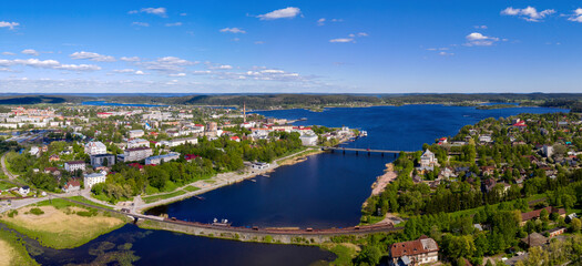 Fototapeta na wymiar Panoramic drone view of Sortavala town andLyappyarvi lake on sunny summer day. Karelia, Russia.