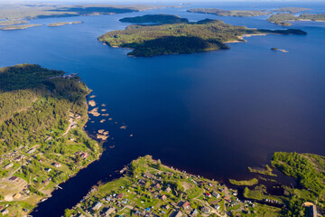 Drone view of Ladoga lake and Hiidenselka village on sunny summer day. Karelia, Russia.