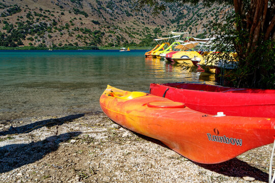 red orange Cayak boat at lake in greece,
Greece, Crete - Georgioupolis - 2022.07