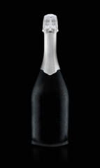 Black exquisite wine bottle covered with drops isolated on black background.