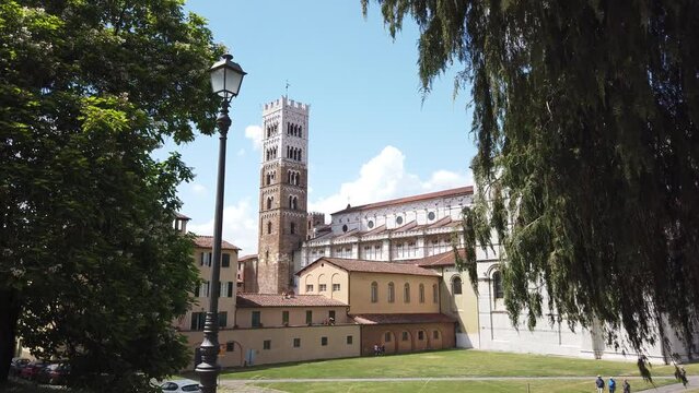 Steadicam shot of Lucca cathedral tower from the city walls, Italy