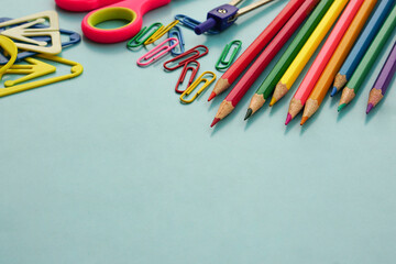 School supplies and office supplies on blue background. Learning, study, office equipment and presentation concept.