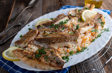 Sauteed fish with red lentil risotto