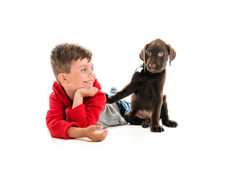 cute five year old boy studio portrait on white background with his Labrador Retriever dog