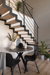 Small dining table under stairs