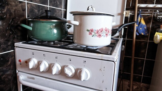 Closeup shot of vintage pots on an old gas stove
